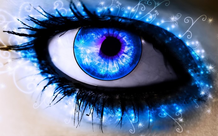 Close-up of a blue eye with magical effects