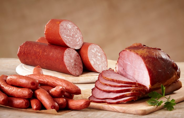 Sausages and Ham on Wooden Boards