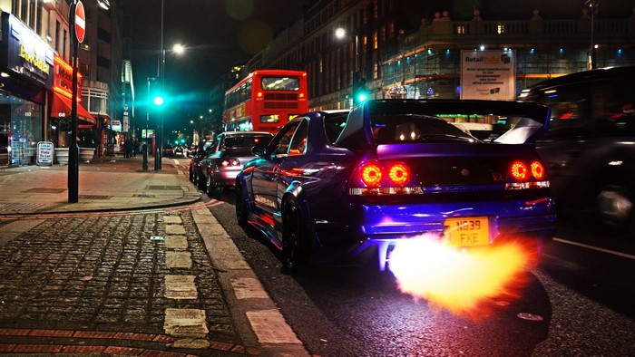 4K Nissan with flames coming out of exhaust on street