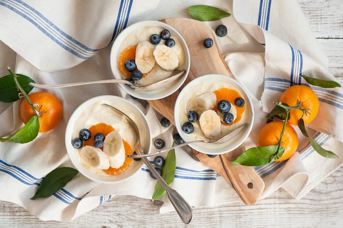 Yogurt bowls with fruit and tangerines