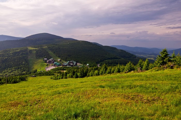 Mountain landscape with houses and forest in Czech Republic