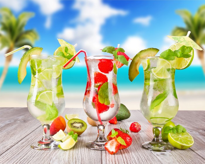 4K Drinks with Strawberry, Kiwi, and Lime on Beach