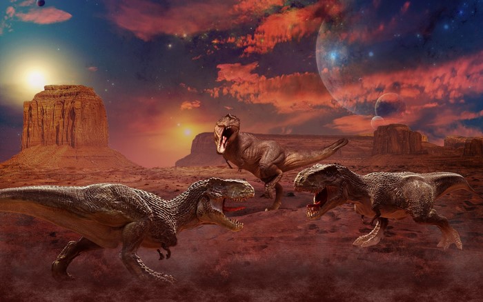 Three Tyrannosaurus Rex dinosaurs in a desert landscape with planets in the sky