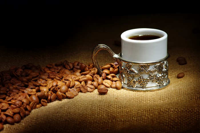 Coffee cup with coffee beans