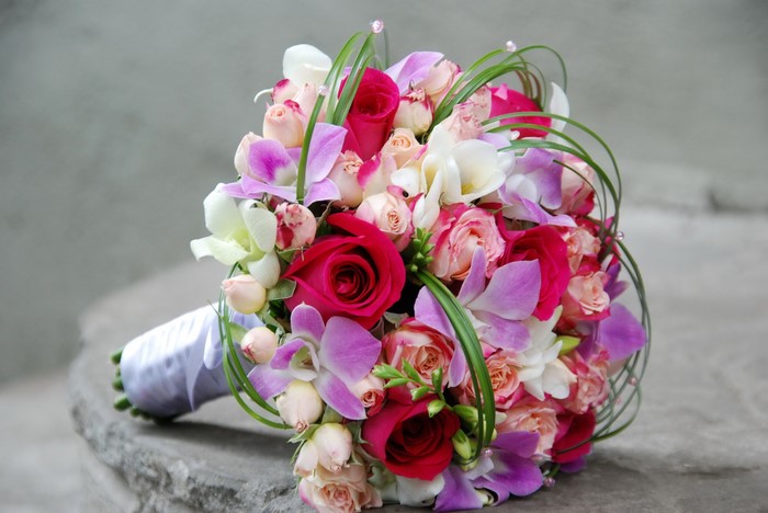 Wedding bouquet with roses and orchids
