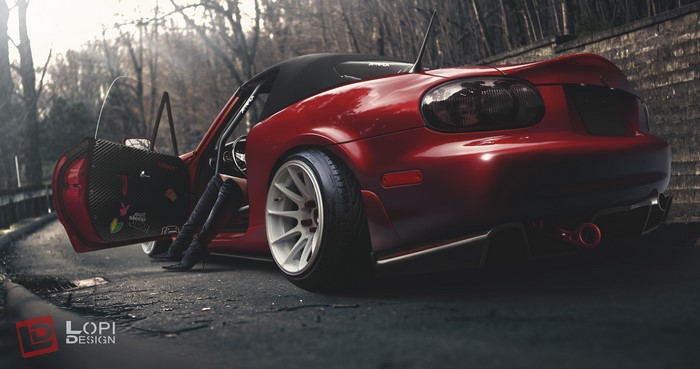Red Mazda MX-5 convertible with open door