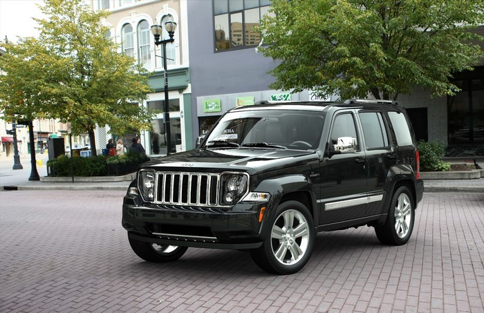 Black 2011 Jeep Liberty parked on brick street