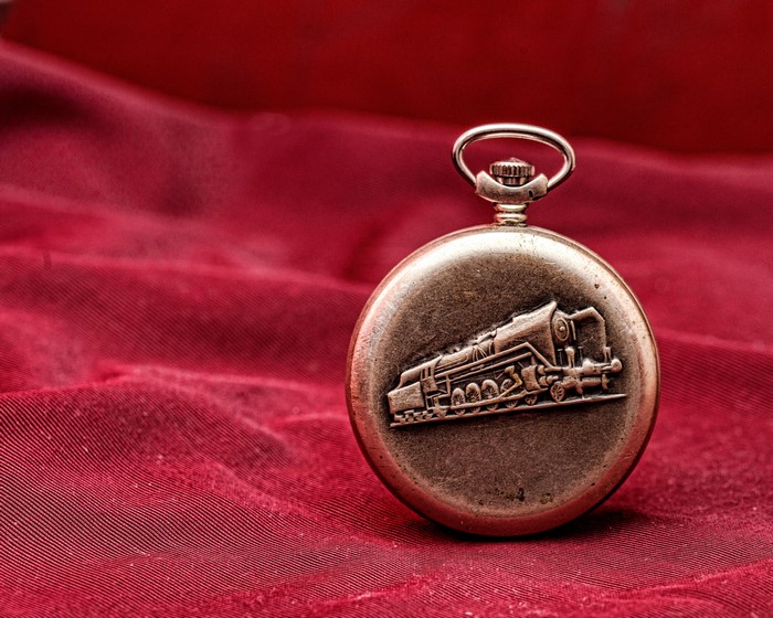 Pocket watch with train engraving