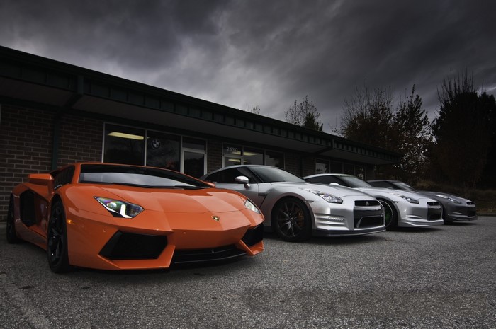 Orange Lamborghini Aventador and silver Nissan GT-R R35 cars