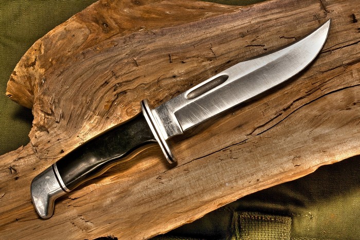 Buck Knife on a piece of wood