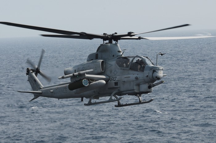 Bell AH-1Z Viper helicopter flying over the ocean