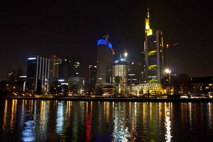 Frankfurt skyline at night with river reflection