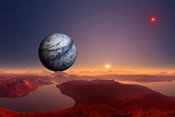 Alien planet landscape with a moon and two suns