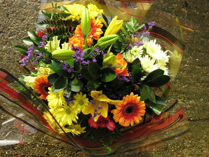 Colorful bouquet of flowers including lilies, gerberas, and chrysanthemums