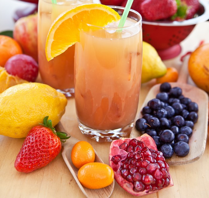 Fruit juices with strawberries, blueberries, lemons, and pomegranate