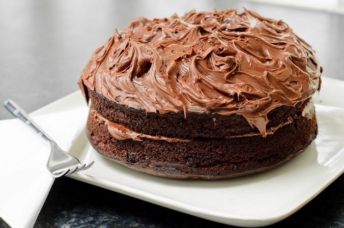 Chocolate cake with frosting and fork