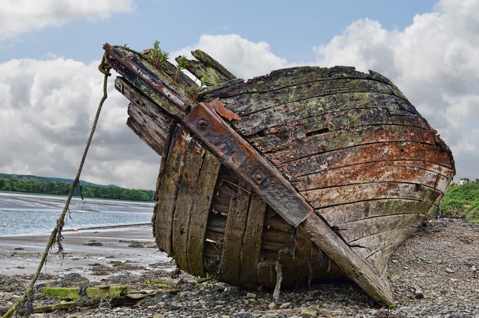 4K Old Boat Wreck on River Shore