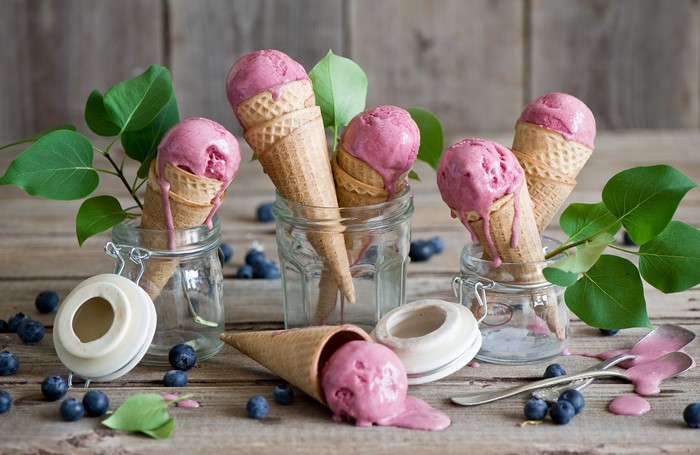 Ice cream cones with blueberries in jars