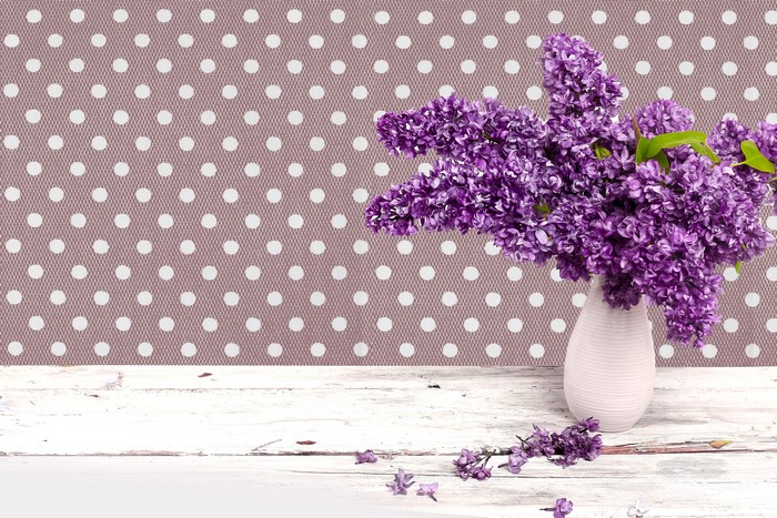 Purple Lilac Flowers in a Vase on a Table
