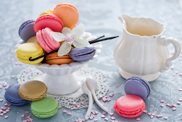 Colorful Macarons on a Cake Stand with a Creamer