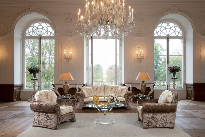 Luxurious living room with ornate chandelier and furniture
