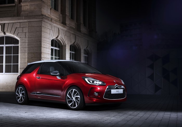 Red 2015 Citroen DS3 parked outside building