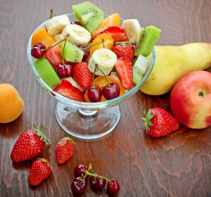 Fruit salad with strawberries, cherries, kiwi, banana, and apple