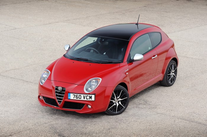 Red Alfa Romeo MiTo Twin Air parked on concrete