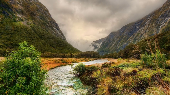 River flowing through a valley with mountains