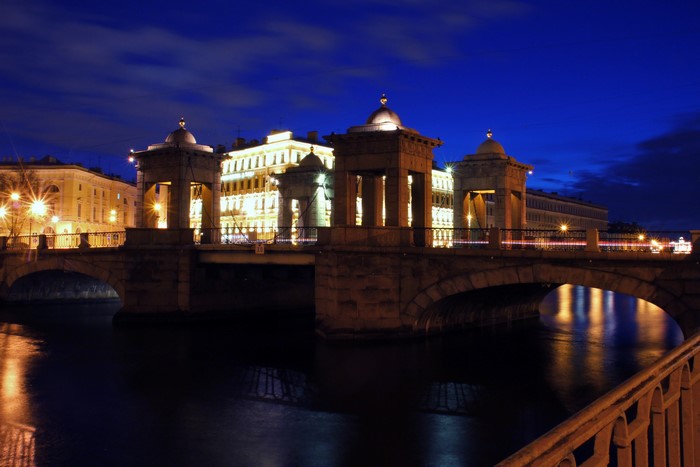 Bridge and buildings at night in St. Petersburg, Russia