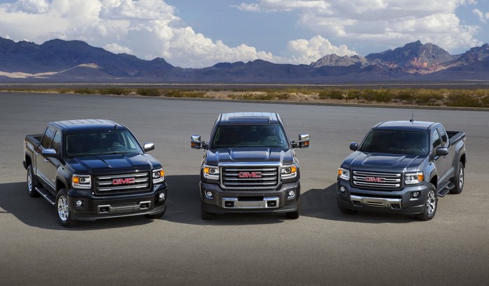 Three GMC Sierra Trucks in a Row