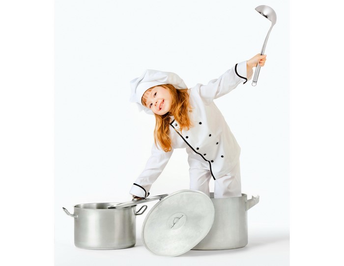 Little girl in chef uniform holding ladle