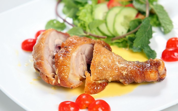 Roast chicken with cherry tomatoes and salad