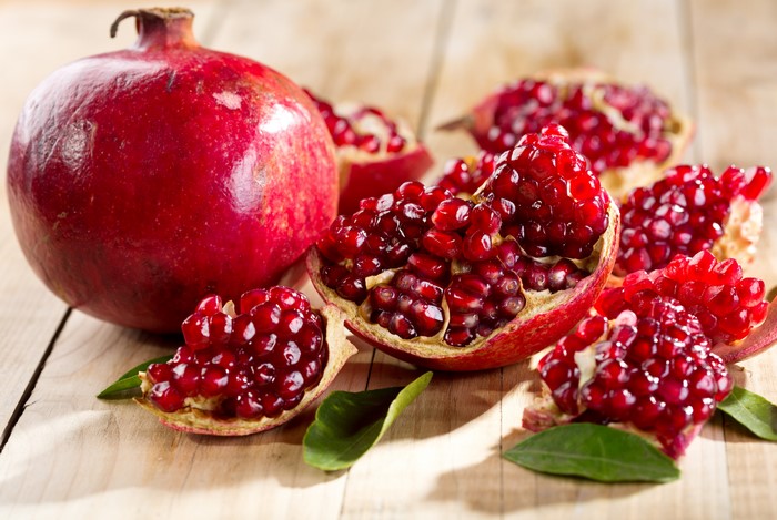 Pomegranates on a Wooden Surface