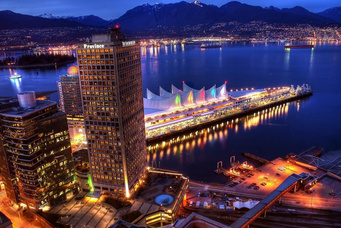 Vancouver waterfront at night with mountains