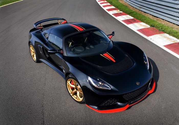 Black Lotus Exige LF1 with Red and Gold Stripes on Track