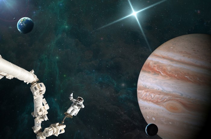Astronauts near Jupiter and Earth