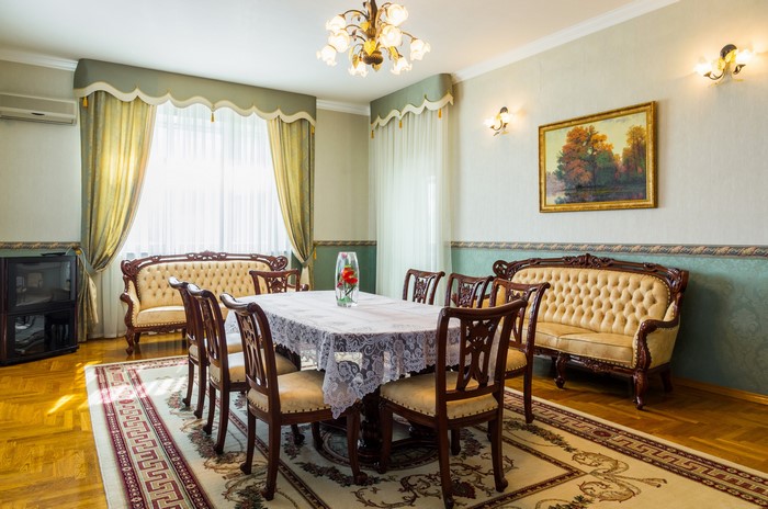 Elegant Dining Room with Ornate Furniture and Artwork