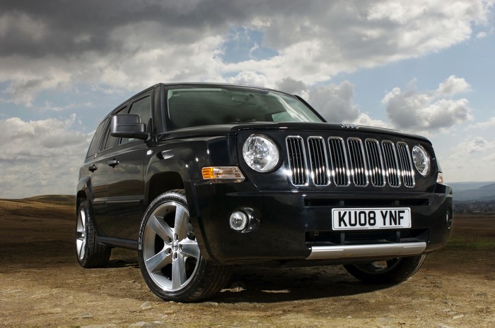 Black Jeep Patriot with KU08 YNF License Plate