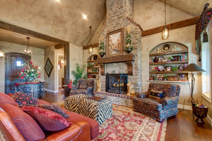 Living room with fireplace, armchair, and carpet