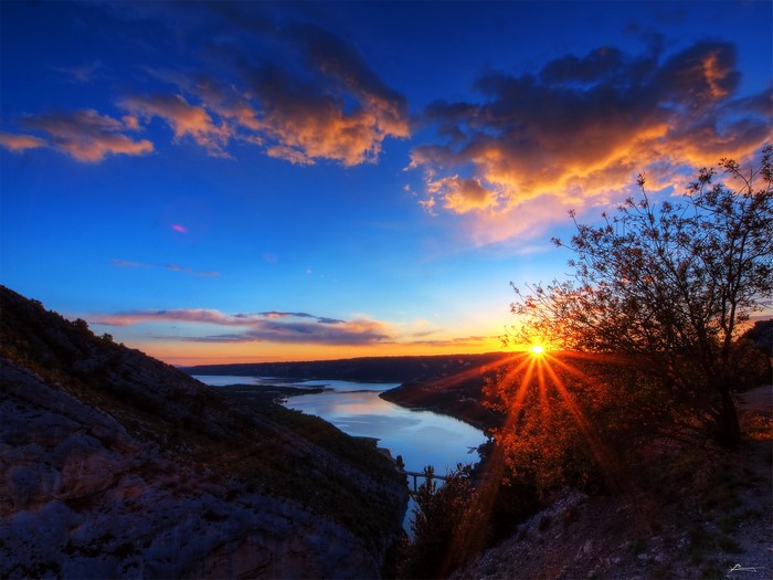 Sunset over a river in Aiguines, France