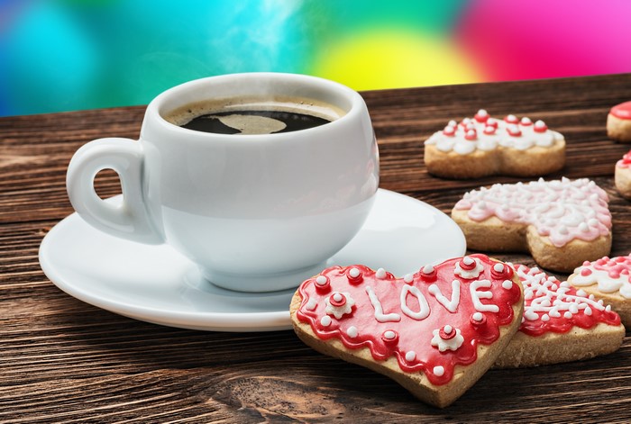 Coffee cup with heart-shaped cookies for Valentine's Day