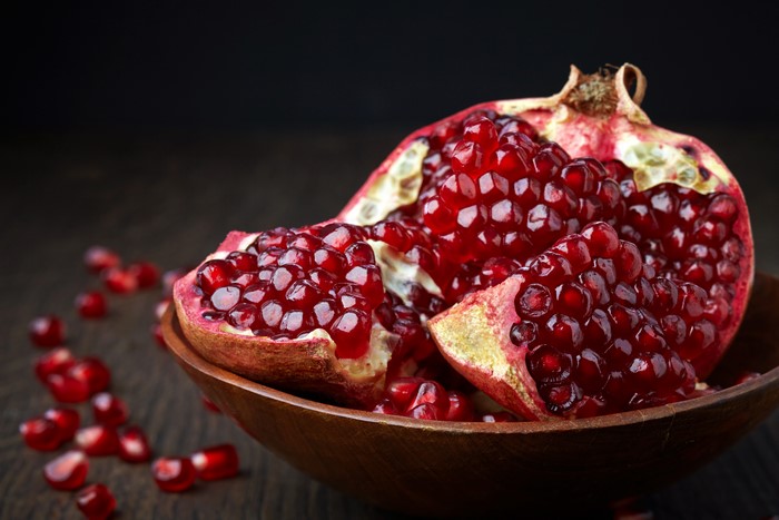 Pomegranate in a Wooden Bowl