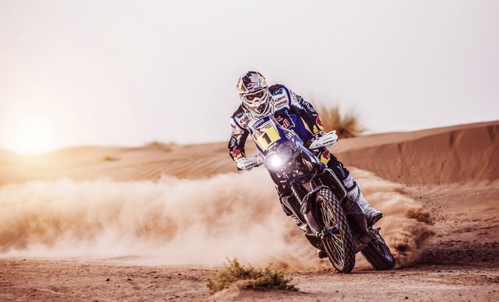 Motorcyclist racing a Yamaha YZ450F in the desert