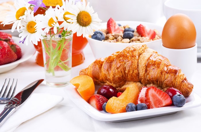 Breakfast with Croissant, Fruits, and Egg