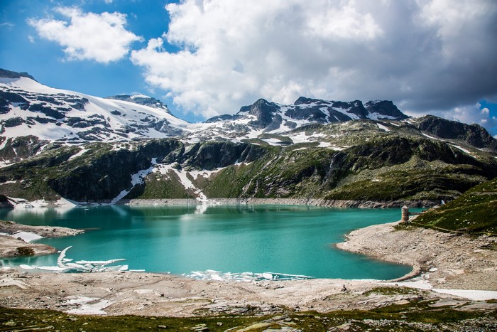 Turquoise lake and snow-capped mountains in Austria