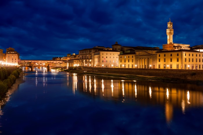 Florence Ponte Vecchio bridge and Arno River at night