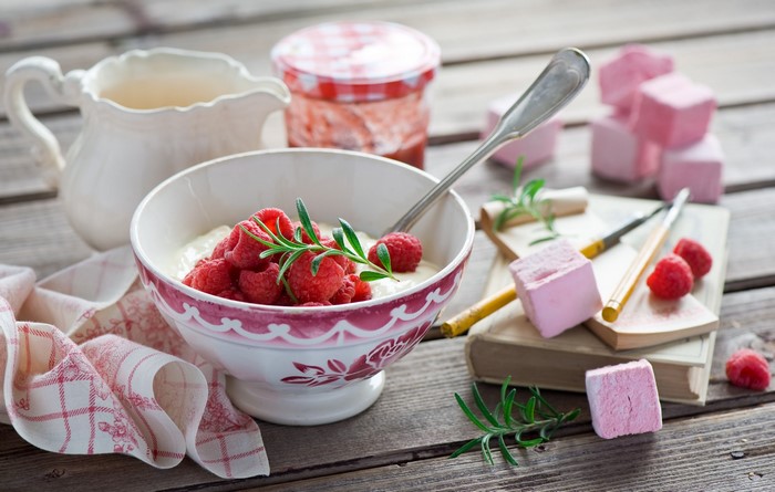 Bowl of yogurt with raspberries and marshmallows