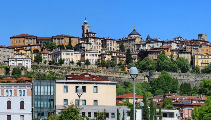 Bergamo, Italy cityscape with historic buildings and trees
