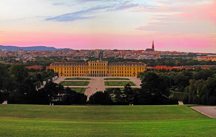 Schönbrunn Palace and Vienna cityscape at sunset